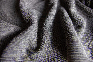 gray ribbed knitted fabric texture textile close up folds clothing background