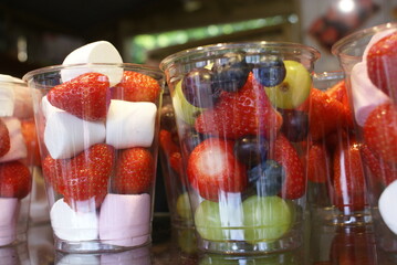 Colorful fruit and marshmallow cups