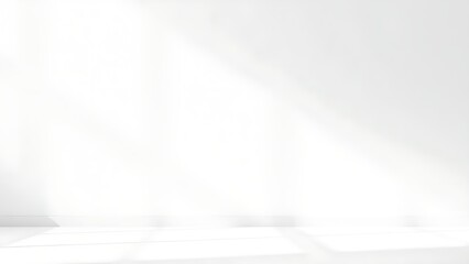 Minimalist white textured wall with subtle shadows and negative space