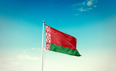 Belarus national flag waving in blue sky.