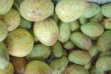 Basket full of ripe tropical mangoes