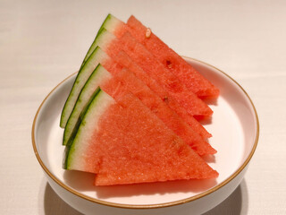 A plate of triangular watermelon slices