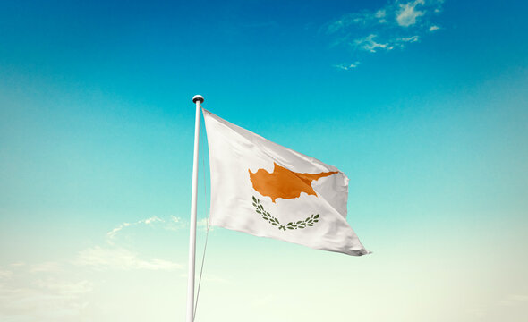 Cyprus national flag waving in blue sky.