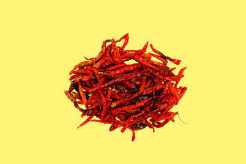 Fototapeta premium Dried chili pepper, chillies spicy. Isolated on yellow background 