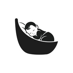 Photo of a cute baby sleeps peacefully in a stylized cradle