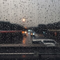 Rainy Day Commute Capturing the City's Atmosphere Through a Wet Window, and Car Reflections