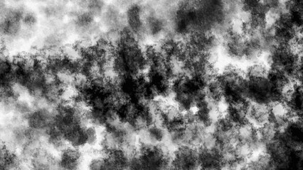 Dark cloudy abstract background in black and white tones with smoky texture effect, ideal for grunge design, overlays, or artistic compositions.