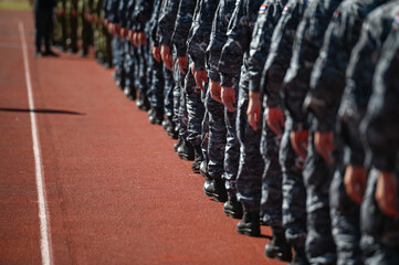 A group of soldiers marching in uniform. Soldiers in a line. Military forces. Army.