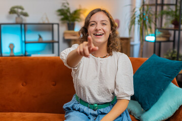 Young woman laughing out loud after hearing ridiculous anecdote, funny joke, feeling carefree...
