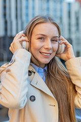 Joyful relaxed overjoyed mature businesswoman listening favorite energetic disco rock n roll music...
