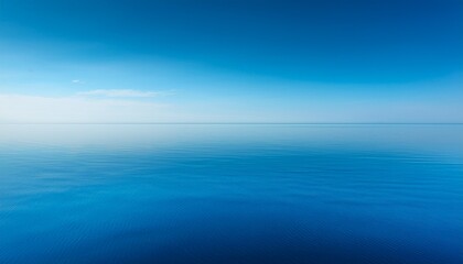 Obraz premium serene minimalist blue horizon with perfect reflection in calm water