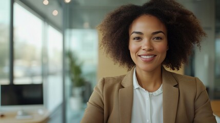 Portrait of young african american woman smiling. A businesswoman in a biracial office video. Visuals of architecture and teamwork at the workplace. Image of a young african lifestyle american woman.