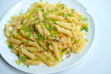 closeup image of pasta plate on white background