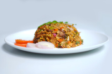 Tasty Asian Kottu Roti with Fresh Herbs and Onion Garnish. asian spicy foods photography.