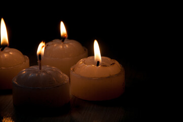 photography of candles in the dark