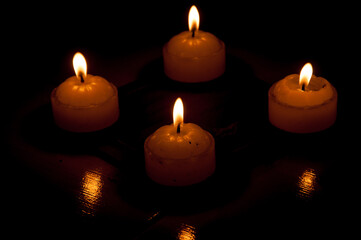 photography of candles in the dark