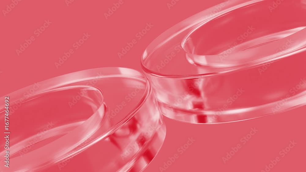 Poster glass rings smoothly rotating against vibrant red backdrop, generating dynamic abstract composition 