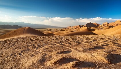 expansive dry landscape in kunduz province reveals geological features under bright sunlight