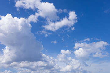 Clouds and daytime sky,Blue sky with scattered white cumulus clouds.