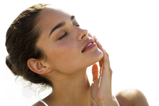 A beautiful young woman with her eyes closed, touching her face, isolated on transparent background, showcasing healthy and radiant skin in a close up portrait