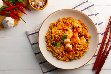 Stir fried instant noodles and shrimp with basil leaves.Thai food.Top view.(pad ka prao)