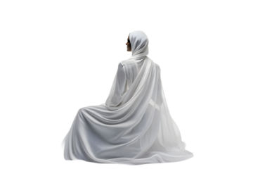 Figure draped in white fabric isolated on white background