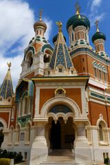 Daytime view of St. Nicholas Orthodox Cathedral in Nice, France, . Stunning Russian Revival architecture surrounded by trees, captured in natural daylight .