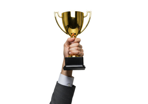 Well-groomed hand in a professional sleeve confidently raising a gleaming, modern golden trophy aloft against a bright, high-key studio background with copy space, concept of professional success