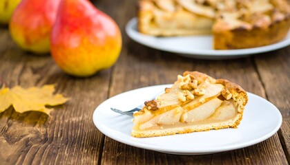 Pear walnut tart slice on a rustic wooden table