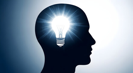 A glowing lightbulb inside the silhouette of a human head symbolizes a brilliant idea innovation creativity and the power of the mind.