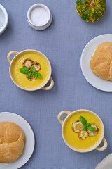 still life with zucchini soup and pumpkin on the table