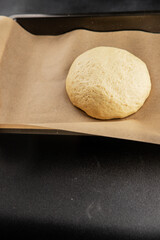 Dough raw cooking yeast, flour, water tasty snack fresh delicious gourmet food background on the table rustic food top view copy space