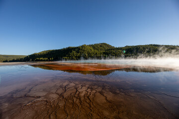 A large body of water with a mountain in the background