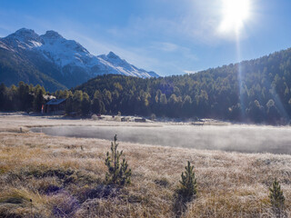 St. Moritz, Switzerland - October 6th 2024: Idyllic lake Lej da Staz in the morning sunlight