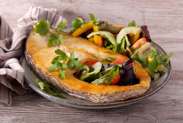 White fish steak with salad
