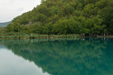 Visitors walking around the lakes at the Plitbice Lakes National Park