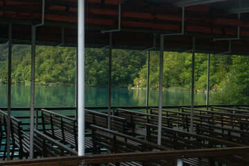 Fototapeta premium Empty seats in the ferry boat at the Plitvice Lakes National Park (Plitvička Jezera, Croatia)