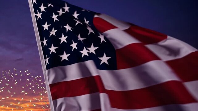 The national flag of the United States of America displayed with fireworks against sunset backdrop