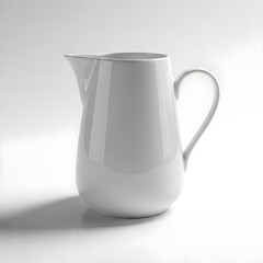 A clean, white ceramic pitcher with a handle and spout, casting a soft shadow on a white surface.