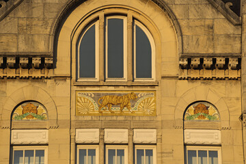 Fototapeta premium mosaic of wild animals on the facade of a building in the zoo of Antwerp, Belgium