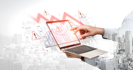 Economic caution visualized with fluctuating market graph, alert symbols, and negative data trends....