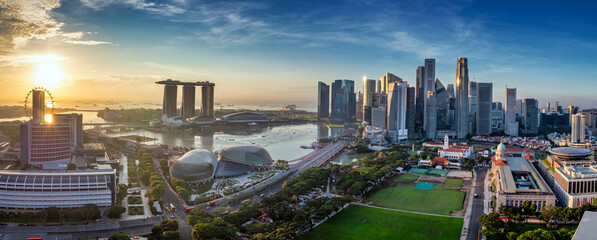 Panoramic sunrise over Singapore Marina Bay and modern skyline