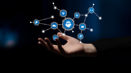A hand extends towards a network of digital icons that symbolize business collaboration, innovation, and communication, set against a dark background for emphasis. Tessel