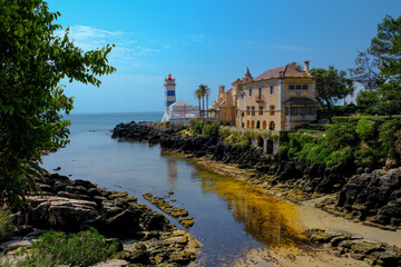 Lighthouse Museum of Santa Marta in Cascais Portugal, as seen from Santa Marta Beach on a beautiful...
