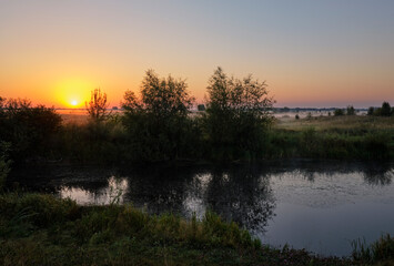 Misty dawn over the lake.