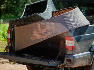 pickup loaded with wickered garden furniture