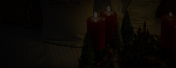 Christmas table composition. Beautiful decoration. Christmas trees, candles, stars, lights and...