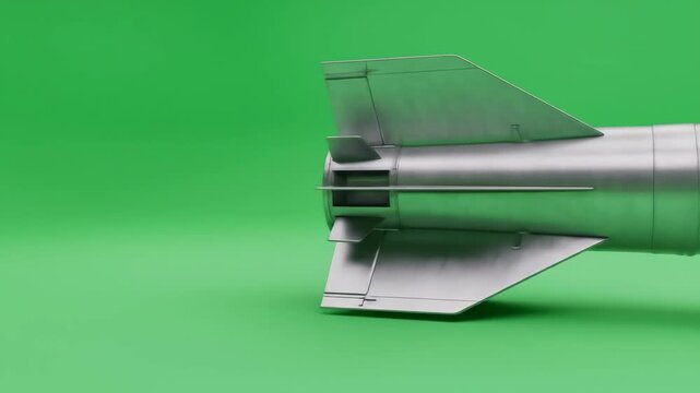 Large Rocket on Green Screen - Close-up view of a large, unguided artillery rocket against a chroma key green screen background. The rocket's fins and rear section are clearly visible.