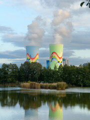 beautiful painted pipes with smoke coming out against the backdrop of a pond