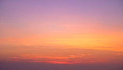 Obraz premium Serene sunset sky showcasing a gradient of soft orange, pink, and purple hues.